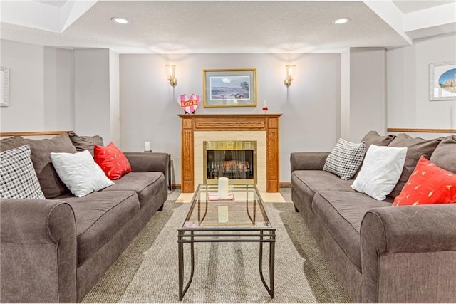 living room with light carpet and a textured ceiling