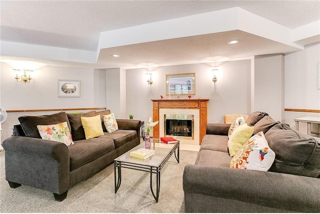 carpeted living room with a textured ceiling