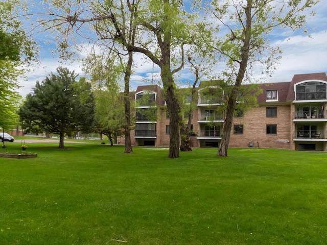 view of community with a yard