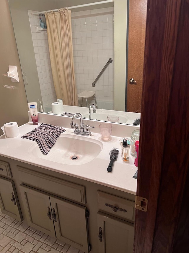 bathroom featuring vanity, tile patterned floors, toilet, and walk in shower