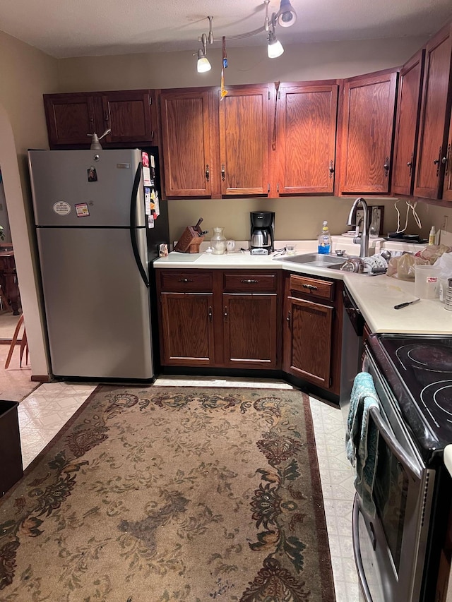 kitchen featuring appliances with stainless steel finishes and sink