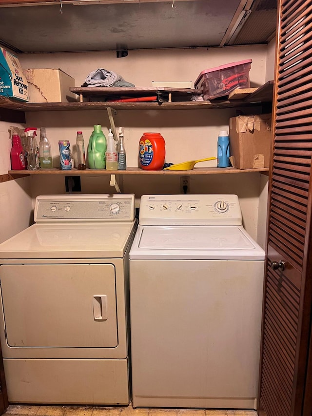 washroom with washing machine and dryer