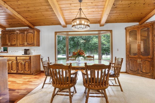 dining room with a notable chandelier, lofted ceiling with beams, wood ceiling, and light wood-type flooring