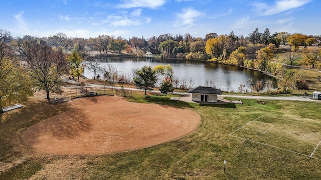 view of community with a water view and a yard