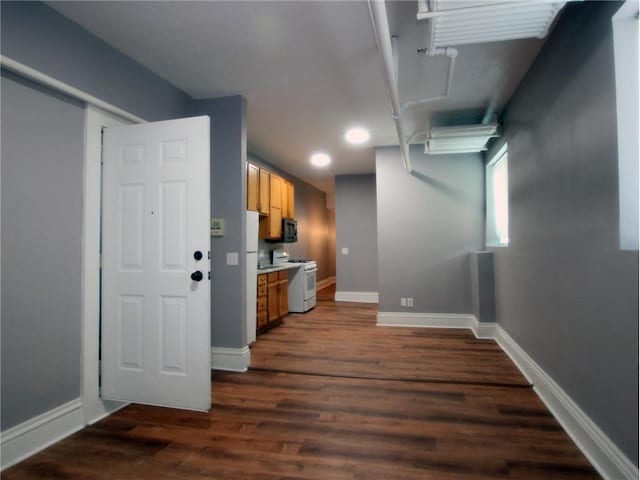 kitchen with dark hardwood / wood-style flooring and white range oven