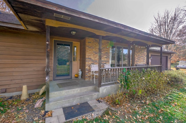 property entrance featuring covered porch