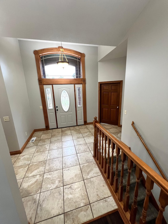 entrance foyer with light tile patterned flooring