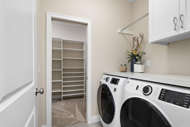 laundry room with cabinets, light colored carpet, and washing machine and dryer