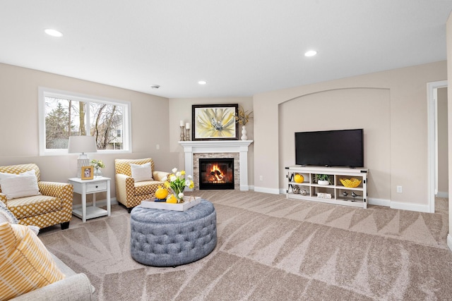 carpeted living room with a fireplace