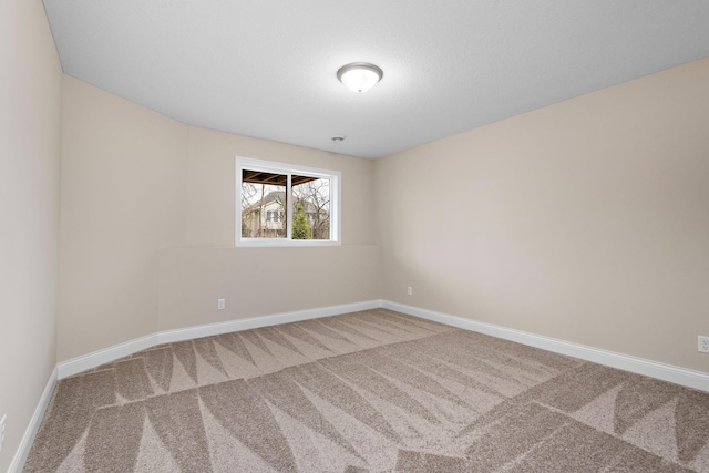 unfurnished room with carpet flooring