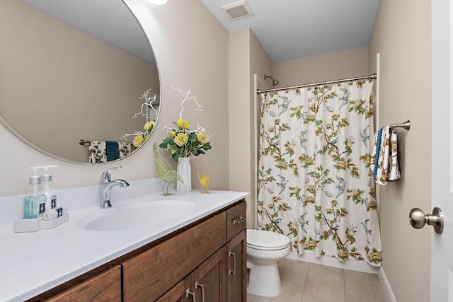 bathroom with vanity, a shower with curtain, toilet, and tile patterned flooring