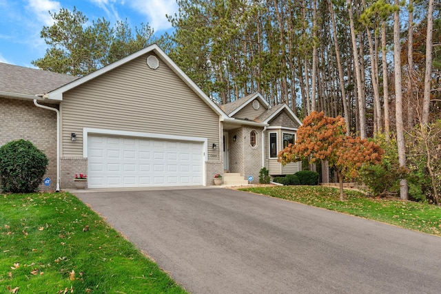 view of front facade featuring a garage and a front lawn