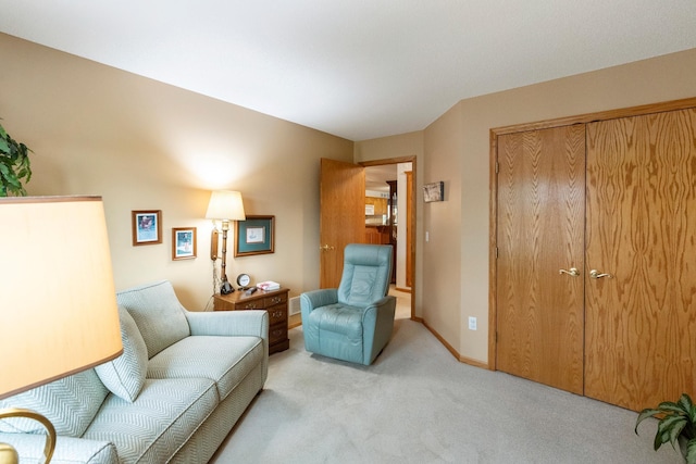 living area with light carpet