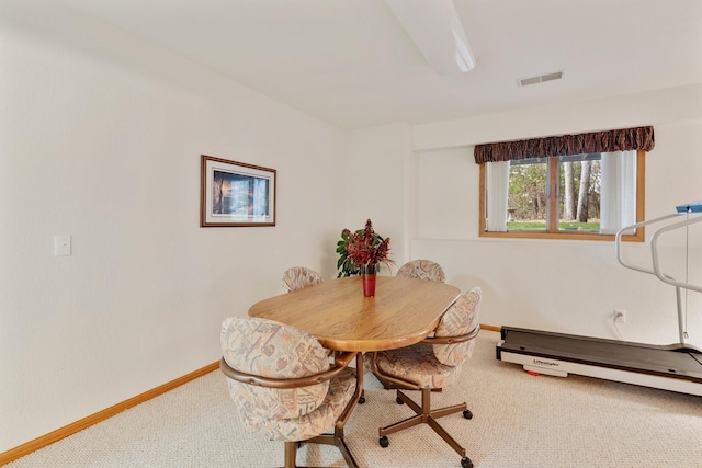 dining area featuring carpet flooring