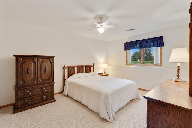 bedroom featuring ceiling fan and light colored carpet