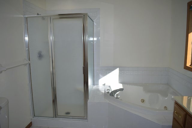 bathroom with vanity and plus walk in shower