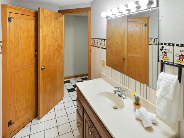 bathroom with vanity and tile patterned flooring