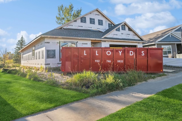 view of property exterior with a lawn