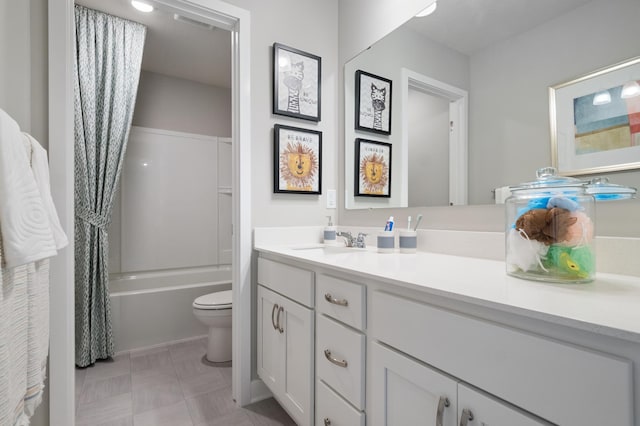 bathroom featuring toilet, vanity, and shower / tub combo with curtain