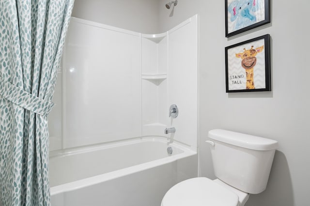 bathroom featuring shower / tub combo with curtain and toilet