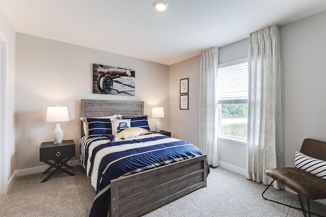 carpeted bedroom with baseboards