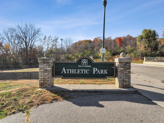 community sign with fence