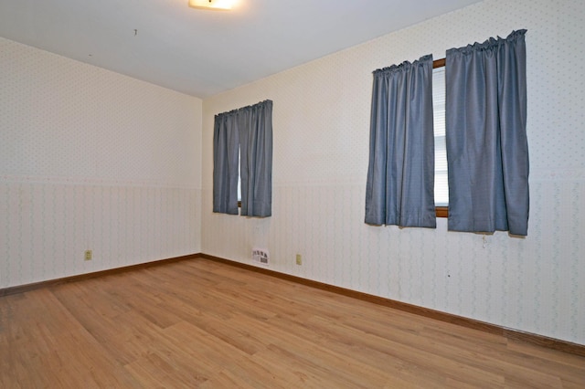 spare room featuring hardwood / wood-style flooring