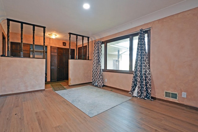 empty room featuring wood-type flooring