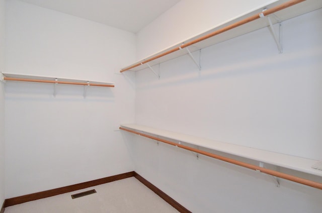 spacious closet featuring visible vents