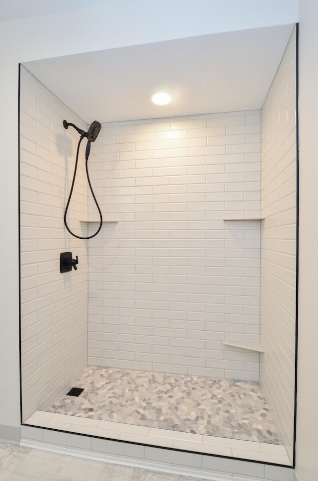 bathroom featuring a stall shower and recessed lighting