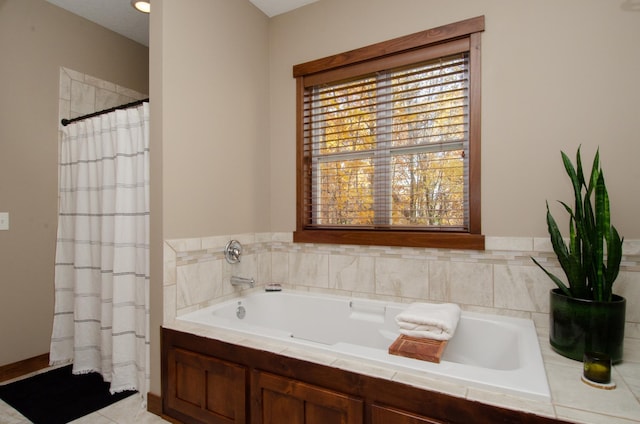 bathroom featuring a garden tub and a shower with shower curtain