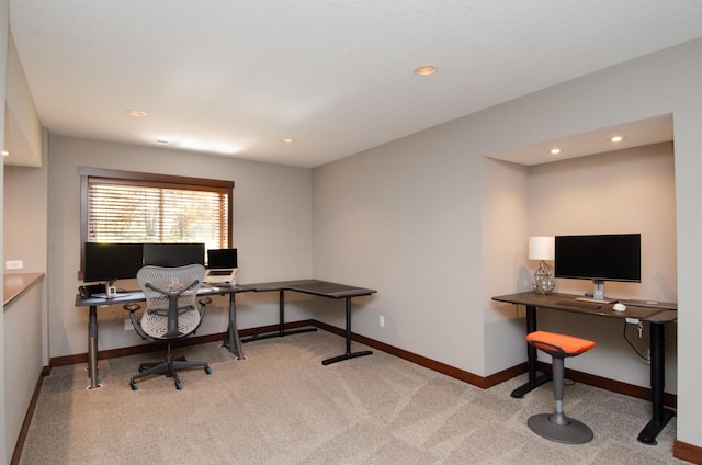 office space featuring recessed lighting, light colored carpet, and baseboards