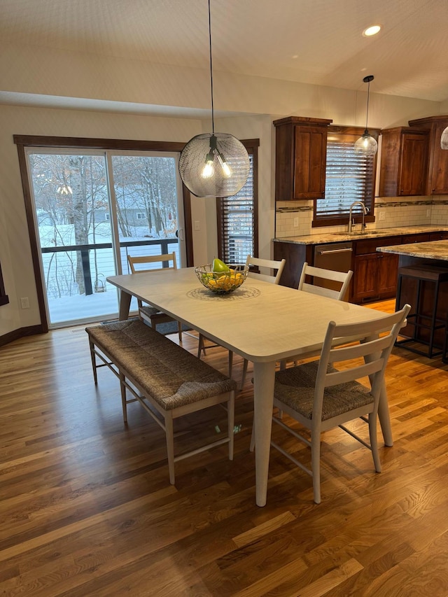 dining area featuring recessed lighting, baseboards, and wood finished floors