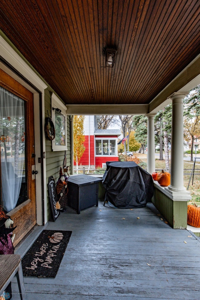 deck with covered porch and area for grilling