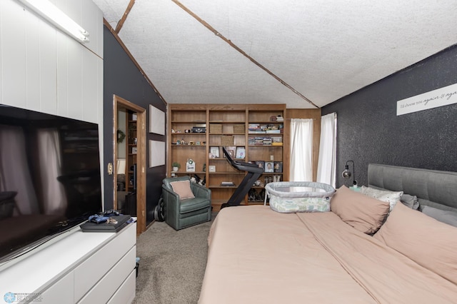 carpeted bedroom with a textured ceiling and vaulted ceiling