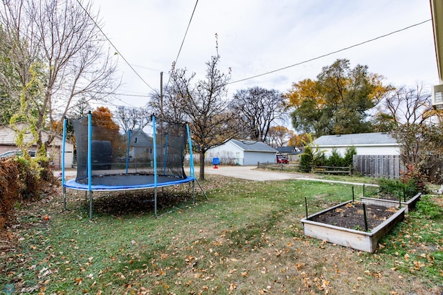 view of yard with a trampoline