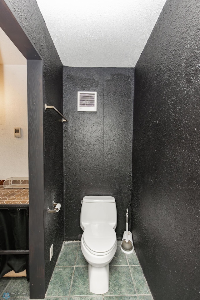 807 4th St S, Moorhead, MN 56560 - bathroom featuring toilet and tile patterned flooring