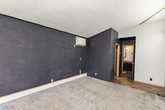 807 4th St S, Moorhead, MN 56560 - spare room featuring carpet flooring, a textured ceiling, and a textured wall