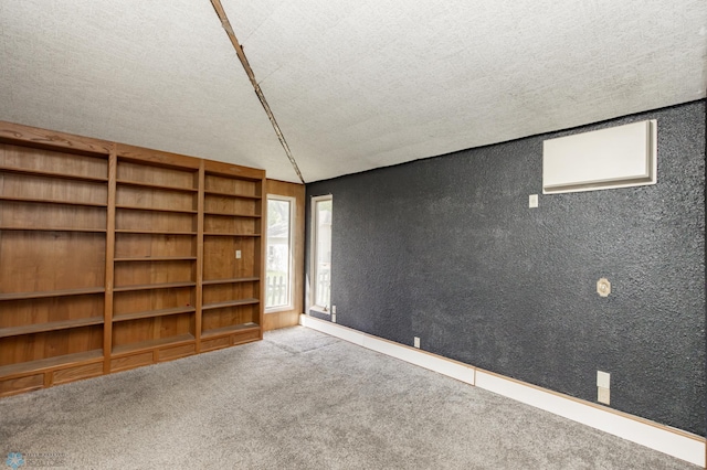 807 4th St S, Moorhead, MN 56560 - empty room with carpet flooring and a textured ceiling