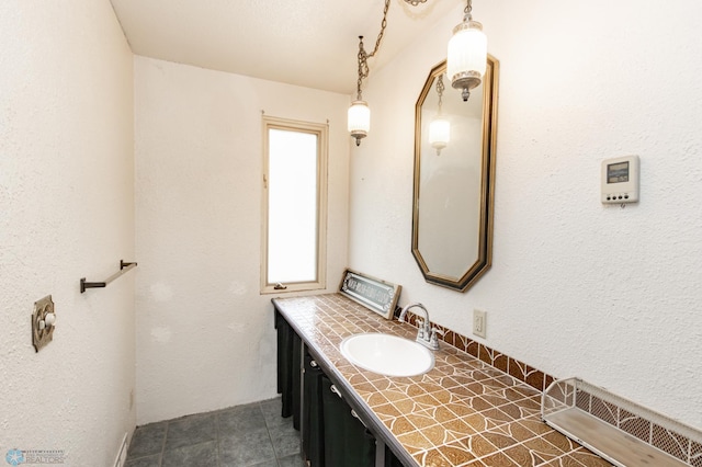 807 4th St S, Moorhead, MN 56560 - bathroom featuring vanity and tile patterned floors