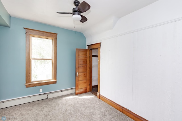 807 4th St S, Moorhead, MN 56560 - unfurnished bedroom with carpet flooring, a baseboard heating unit, a ceiling fan, and baseboards