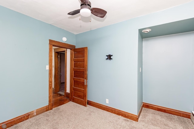 807 4th St S, Moorhead, MN 56560 - unfurnished room featuring carpet floors, a ceiling fan, and baseboards