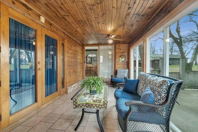 sunroom / solarium with ceiling fan and wood ceiling