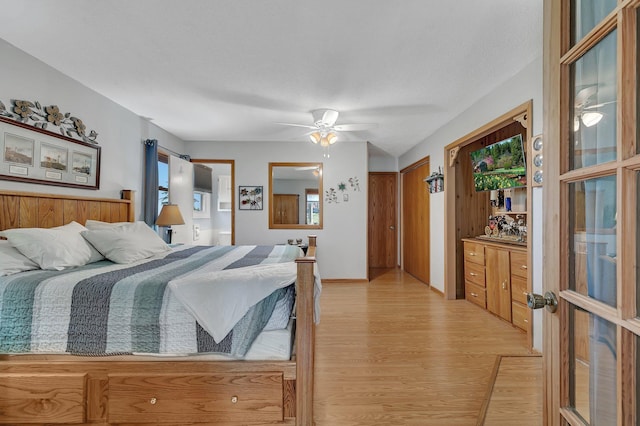 bedroom featuring light hardwood / wood-style floors and ceiling fan