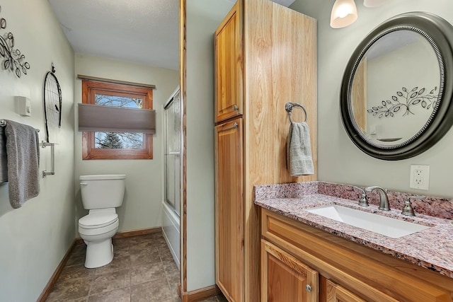 full bathroom featuring vanity, toilet, tile patterned flooring, and bath / shower combo with glass door