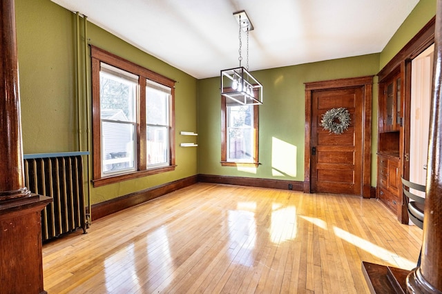 unfurnished dining area with light hardwood / wood-style flooring