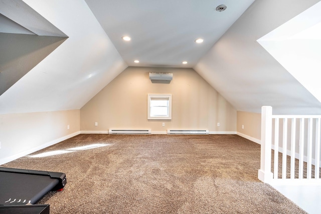 bonus room featuring a baseboard heating unit, a wall mounted AC, carpet, and vaulted ceiling