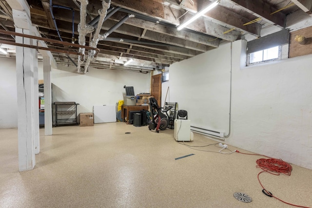 basement with a baseboard heating unit