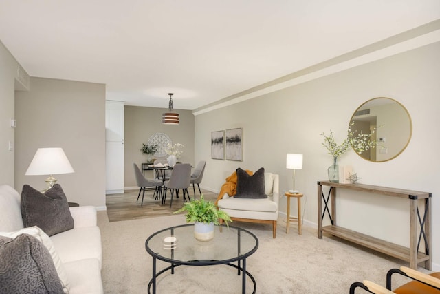 living room featuring light carpet