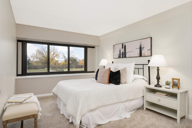 bedroom featuring light carpet